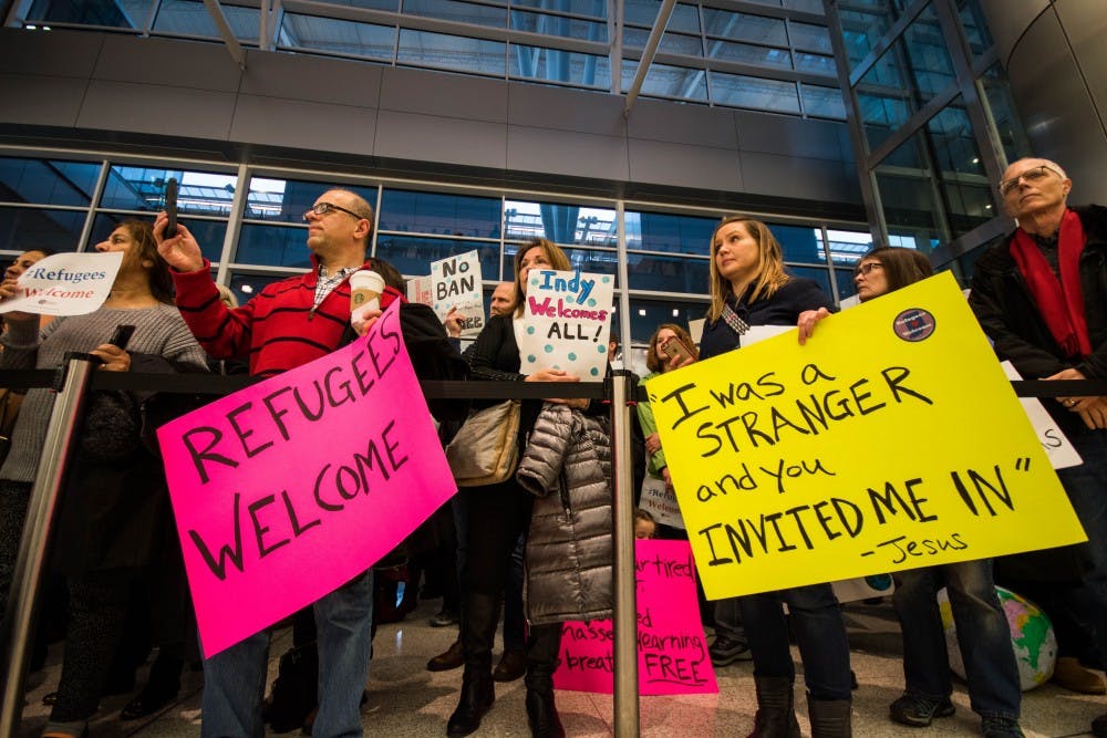 Hundreds of protestors surround the baggage carousel, at the Indianapolis Airport on Jan. 29, after President Trump's executive orders on immigration. Stephanie Amador // DN