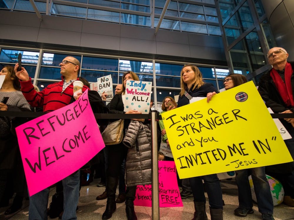 Hundreds of protestors surround the baggage carousel, at the Indianapolis Airport on Jan. 29, after President Trump's executive orders on immigration. Stephanie Amador // DN