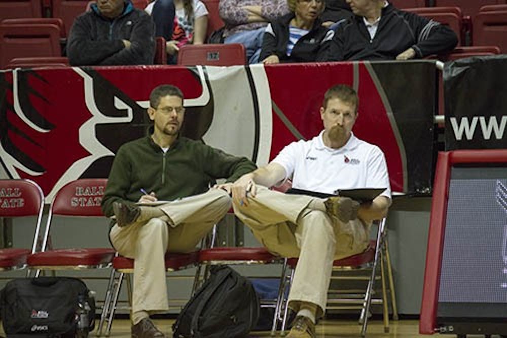 Assistant coaches Jim Palilonis and Kevin Furnish watch a men's volleyball match during Ball State's 2013 21-6 season. Palilonis has been hired as a full-time, paid coach. DN FILE PHOTO EMMA FLYNN