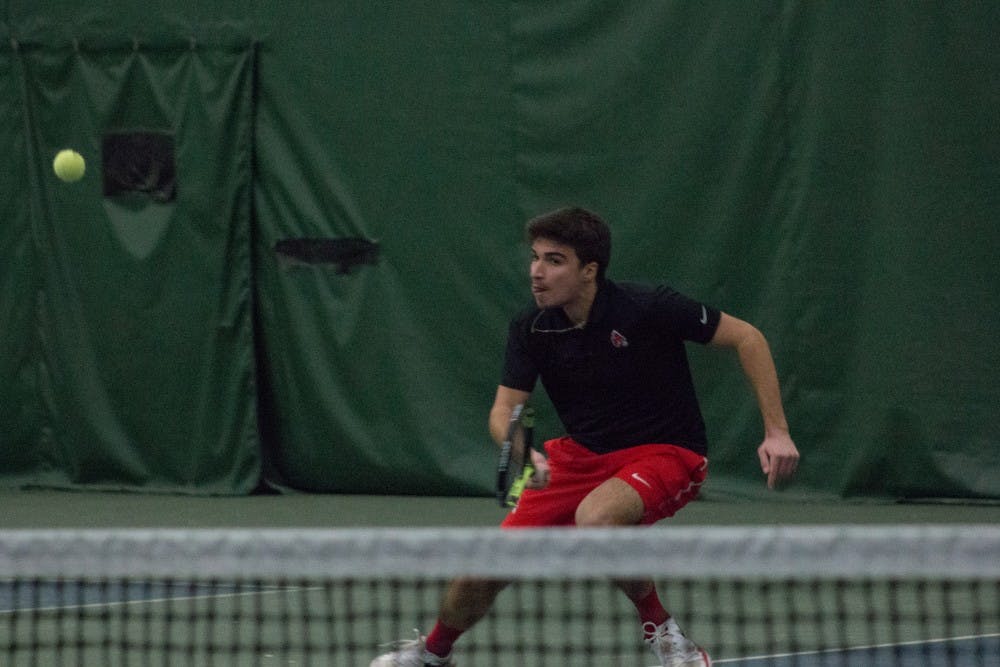 <p>Junior Nemanja Guzian goes after the ball in a tennis match against IU Southeast at Northwest YMCA in Muncie, Ind. Feb. 3. <strong>Eric Pritchett, DN</strong></p>