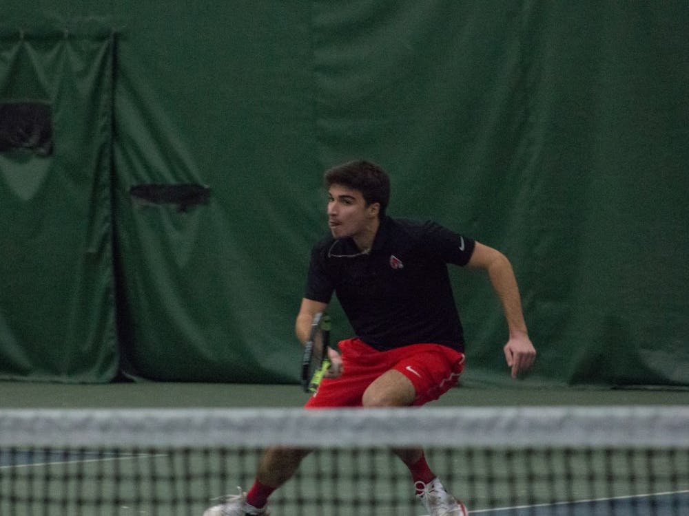 Junior Nemanja Guzian goes after the ball in a tennis match against IU Southeast at Northwest YMCA in Muncie, Ind. Feb. 3. Eric Pritchett, DN