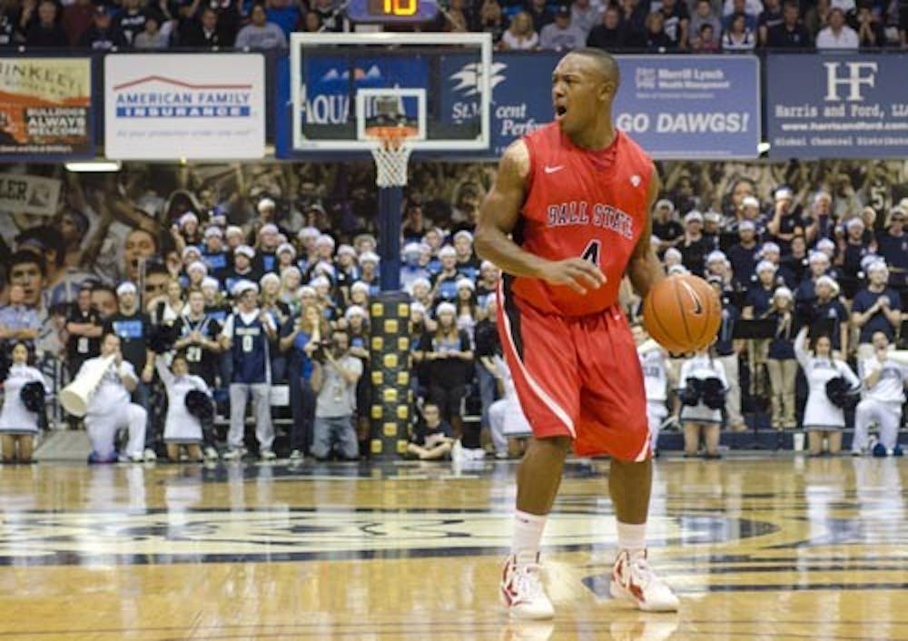 Jauwan Scaife makes a play call in the second half of the game against Butler University on Saturday. Ball State tied Butler going into the half but fell behind for a Butler win of 67-53. DN PHOTO COREY OHLENKAMP