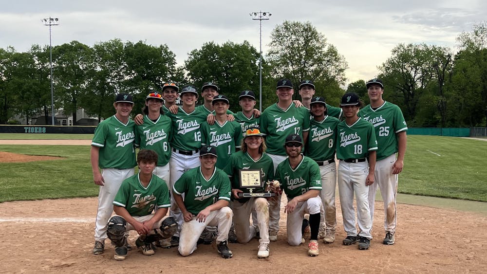 Yorktown Tigers Baseball poses for a team photo after their Delaware County Championship victory May 14, 2022 at Tiger Field in Yorktown, Indiana. Yorktown defeated the Delta Eagles 11-2. Kyle Smedley/DN