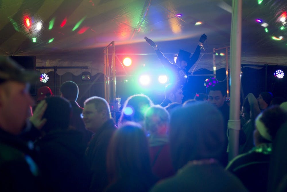 Dance music and wild lights set the scene after the sun went down on Muncie Gras. DN PHOTO ROSS MAY