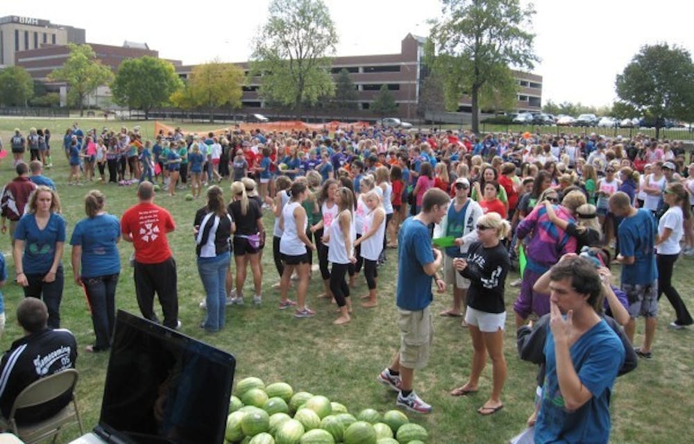 Hundreds of students wait for Watermelon Bust to start. Watermelon Bust was moved to West Campus Field because of geothermal construction on Lafollette Field. PHOTO COURTESY OF WADE BAERTSCHI