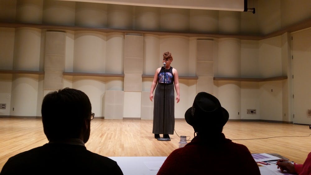 <p>The Poetry Slam took place on Feb. 15 at Pruis Hall. Nine contestants performed a poem of their choice for three judges. DN PHOTO LAURA ARWOOD</p>