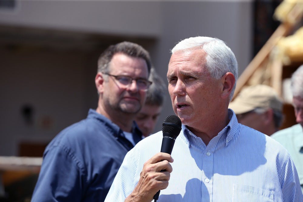 Scott Jones, senior pastor of First Baptist Rockport, listens as Vice President Mike Pence speaks in Rockport, Texas at the First Baptist Rockport on Thursday, Aug. 31, 2017. Several secretaries of state and the vice president visited Rockport to reaffirm the federal government's promise of help for victims of Hurricane Harvey. TNS, Photo Provided