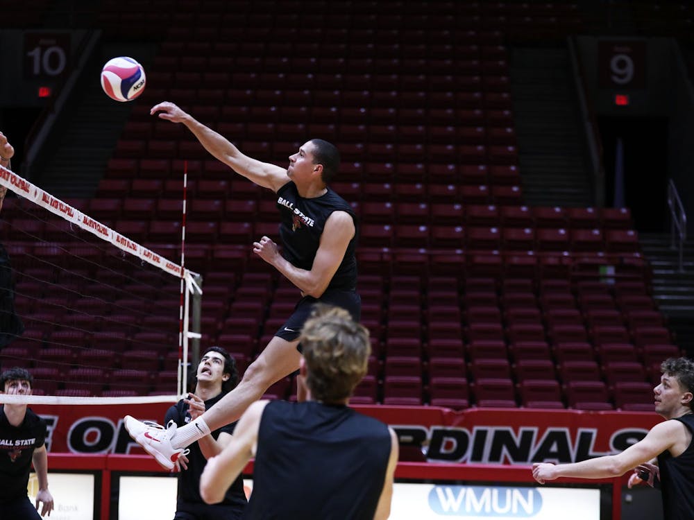 Senior middle blocker Rodney Wallace spikes the ball during a practice Jan. 10 at Worthen Arena. The Cardinals had a 20-win 2023 season. Mya Cataline, DN