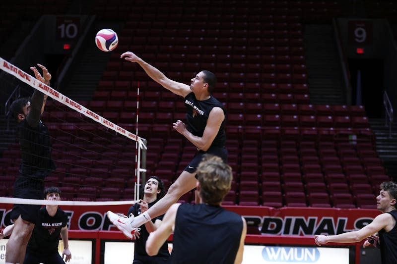 Senior middle blocker Rodney Wallace spikes the ball during a practice Jan. 10 at Worthen Arena. The Cardinals had a 20-win 2023 season. Mya Cataline, DN