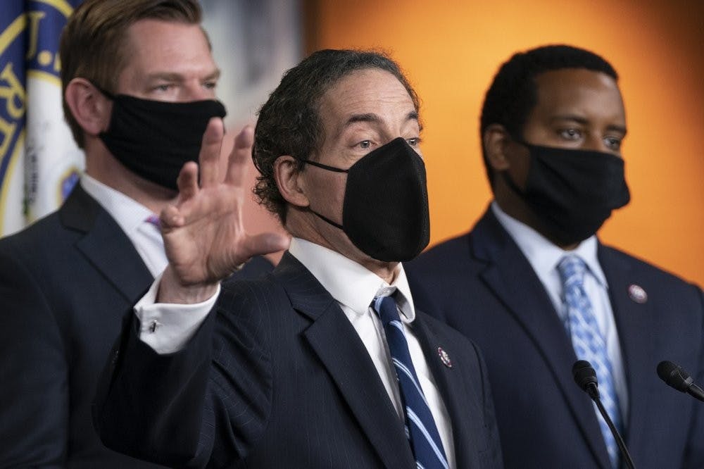 Lead House impeachment manager Rep. Jamie Raskin, D-Md., with impeachment managers Rep. Eric Swalwell, D-Calif., and Rep. Joe Neguse, D-Colo., right, speaks to members of the media during a news conference on Capitol Hill in Washington, Saturday, Feb. 13, 2021, after the U.S. Senate voted to acquit former President Donald Trump, ending the impeachment trial. (AP Photo/Manuel Balce Ceneta)