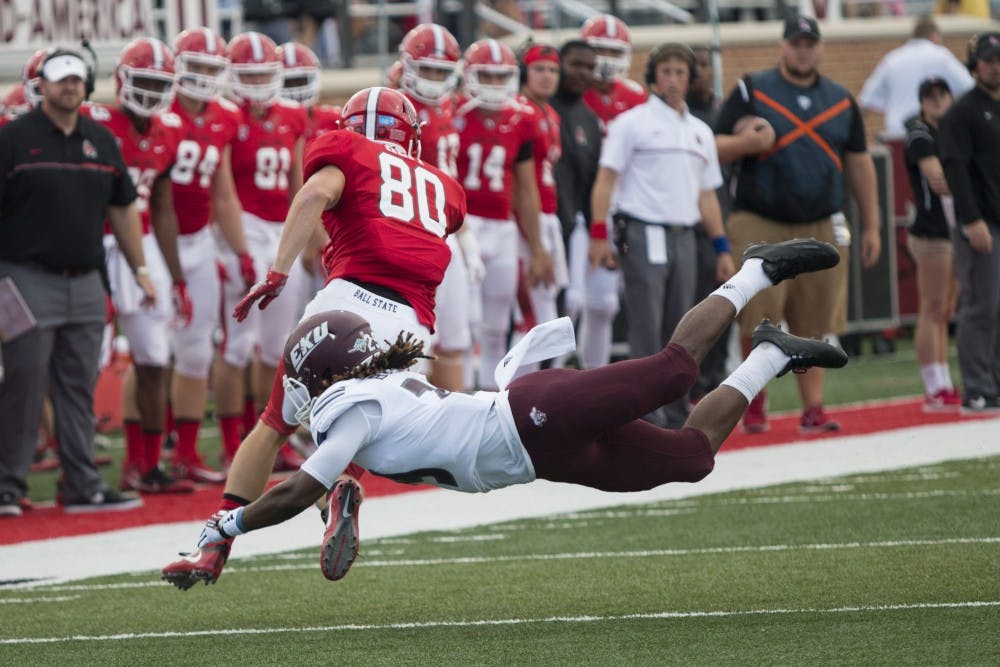 Ball State wide reciever, Aaron Hepp escapes a tackel attempt from Eastern Kentucky University player The Cardinals defeated Eastern Kentucky University, 41-7, in the first game at Scheumann Stadium in Muncie, IN on Saturday, September 17 of the season. (DN, Grace Hollars)