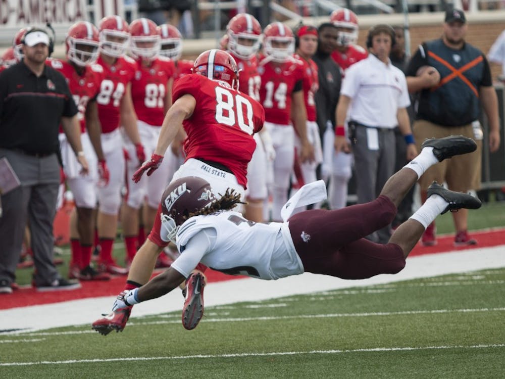 Ball State wide reciever, Aaron Hepp escapes a tackel attempt from Eastern Kentucky University player The Cardinals defeated Eastern Kentucky University, 41-7, in the first game at Scheumann Stadium in Muncie, IN on Saturday, September 17 of the season. (DN, Grace Hollars)
