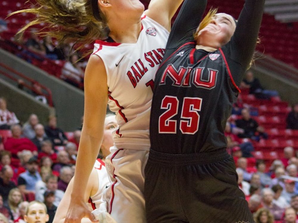Senior Renee Bennett uses her height to steal a rebound from an opponent during the January 28th game against Northern Illinois at Worthern Arena.
