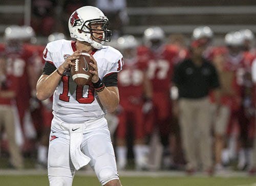Senior quarterback Keith Wenning drops back during a game against Illinois State on Thursday at Scheumann Stadium. Wenning had five touchdowns. DN PHOTO JONATHAN MIKSANEK