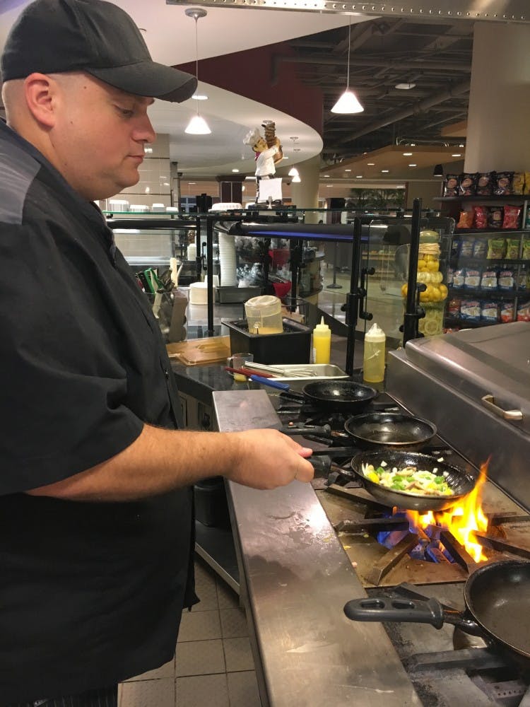 Chef Matt Hunter prepares an omelet for a student Sept. 19, 2018 in Muncie. Hunter said after the breakfast rush, he will have to start smoking more than 100 pounds of salmon for the Sunday Brunch. Tier Morrow, DN