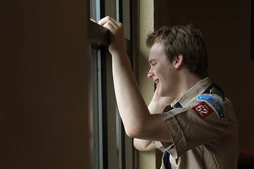 Boy Scout Pascal Tessier talks on the phone after hearing the announcement that the Boy Scouts of America passed a resolution allowing scouts that are openly gay into their ranks. The resolution has not set well with the Southern Baptists, who have called for their churches to stop supporting local scouts. MCT PHOTO