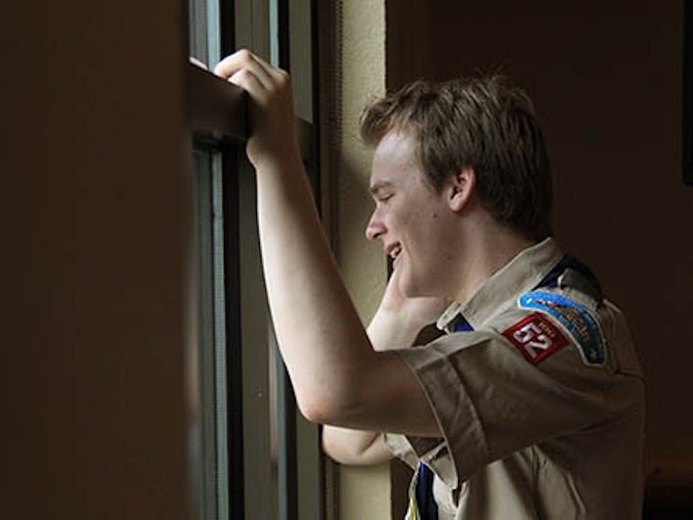Boy Scout Pascal Tessier talks on the phone after hearing the announcement that the Boy Scouts of America passed a resolution allowing scouts that are openly gay into their ranks. The resolution has not set well with the Southern Baptists, who have called for their churches to stop supporting local scouts. MCT PHOTO