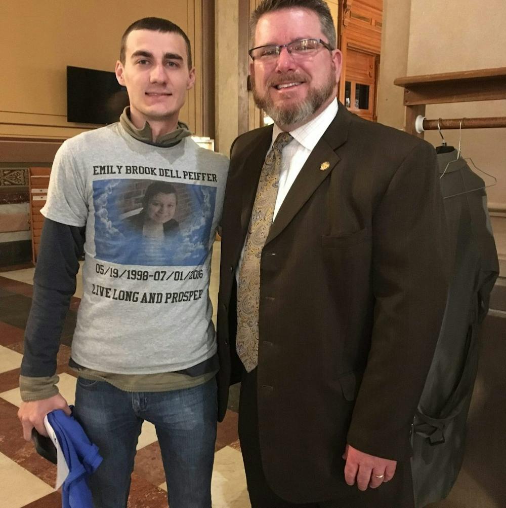 <p>Matt Peiffer (left) poses next to State Representative Kevin Mahan (right) after advocating for a &nbsp;bill in memory of his sister Emily. Peiffer said his sister died by suicide at age 18 after struggling with feelings guilty about what had happened to her and her siblings. Photo: Matt Peiffer.&nbsp;</p>