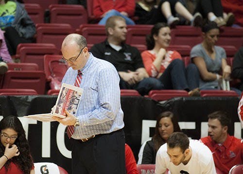 Head Coach Joel Walton makes a note at the conclusion of a play against Limestone College on March 29. Walton was named MIVA coach of the year. DN FILE PHOTO JONATHAN MIKSANEK