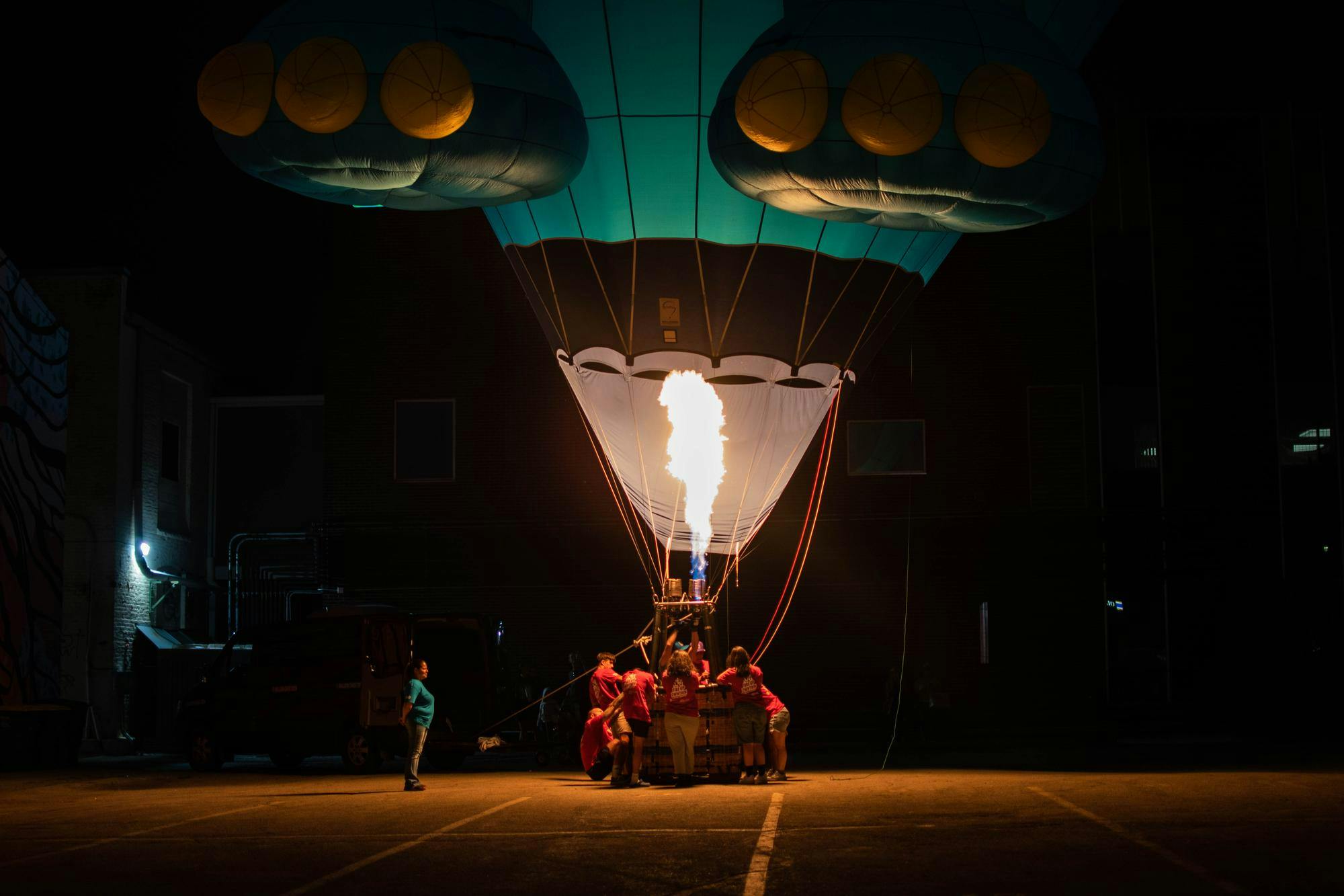 A hot air balloon Glow Show lights up the area during Fire Up Muncie in downtown Muncie, Aug. 2. Featured balloons included Finley the Fish, sponsored by 3Rivers Federal Credit Union; Boo the Ghost, sponsored by MDDP; and vampire balloon Lil D, sponsored by Woof Boom Radio. Kylee White, DN
