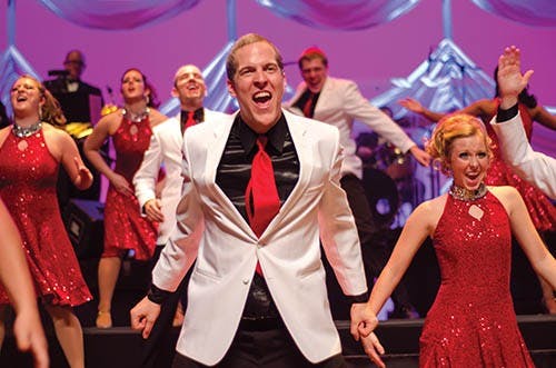 The University Singers rehearse for their 49th Annual Spectacular on Saturday. The show consisted of the chorus performing a wide array of pieces from different genres. DN PHOTO COREY OHLENKAMP