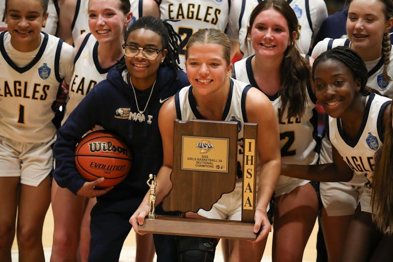 Delta girls' basketball holds the Class 3A Sectional No. 24 trophy Feb. 8 after winning the title at the Connersville Spartan Bowl. This is the first time Delta has won a sectional title since 1993. Zach Carter, DN. 