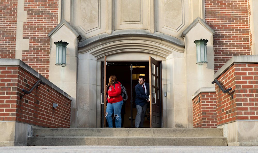 <p>Ball State students are photographed Feb. 3, walking through North Quad doors. Professors from religious studies are being relocated North Quad to fall under the Department of History in Burkhardt. Isabella Kemper, DN</p>