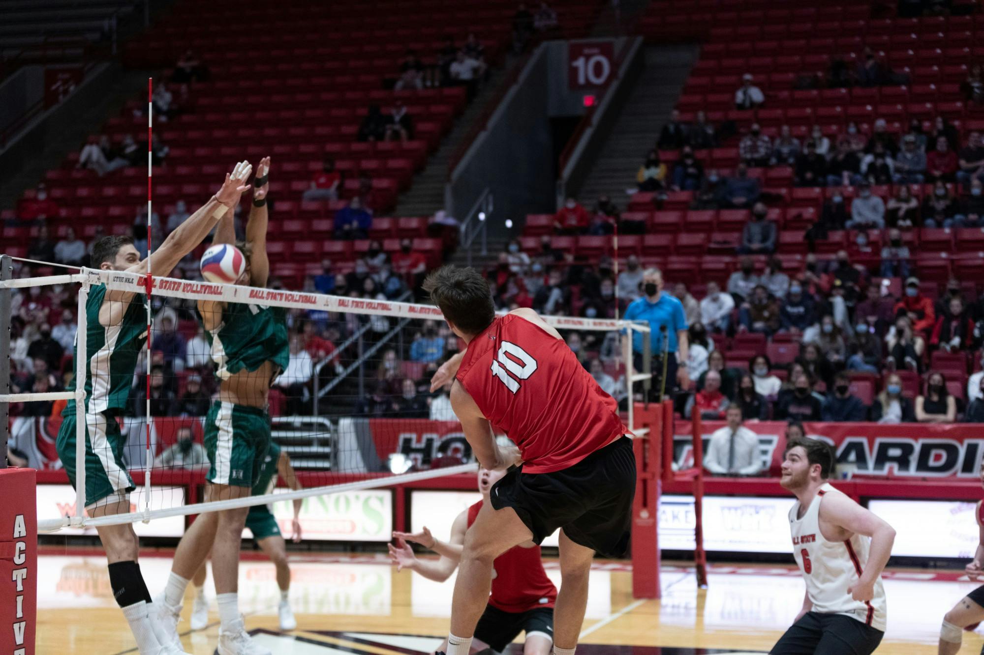 Graduate Student Angelos Mandilaris jumps for a kill Jan. 31 at Worthen Arena. Mandilaris led the Cardinals with 25 kills on the night. Eli Houser, DN