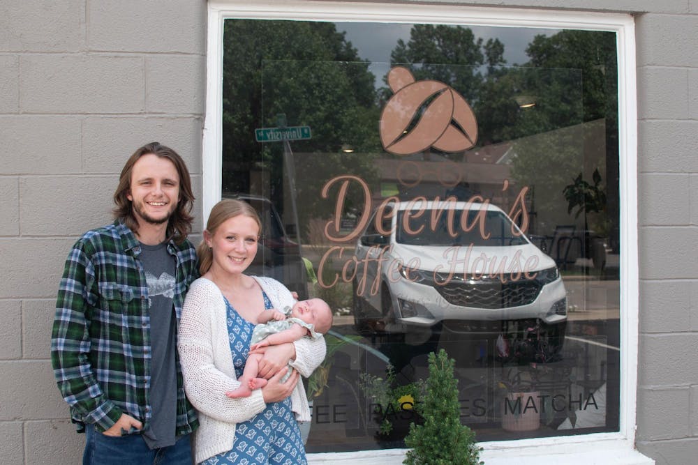 Deena's Coffee Shop owners Alyssa and James Helfer with their daughter, Ruby, photographed outside of their shop, June 25 in Muncie, Indiana. Kylee White, DN Photo.  