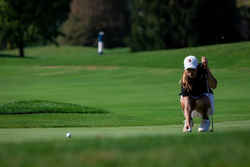 Sophomore Hadley Moritz lines up her ball on the green Sept. 16, 2019, at the Players Club at Woodland Trails in Yorktown, Ind. Moritz ended the third round of the cardinal classic six above par. Eric Pritchett, DN