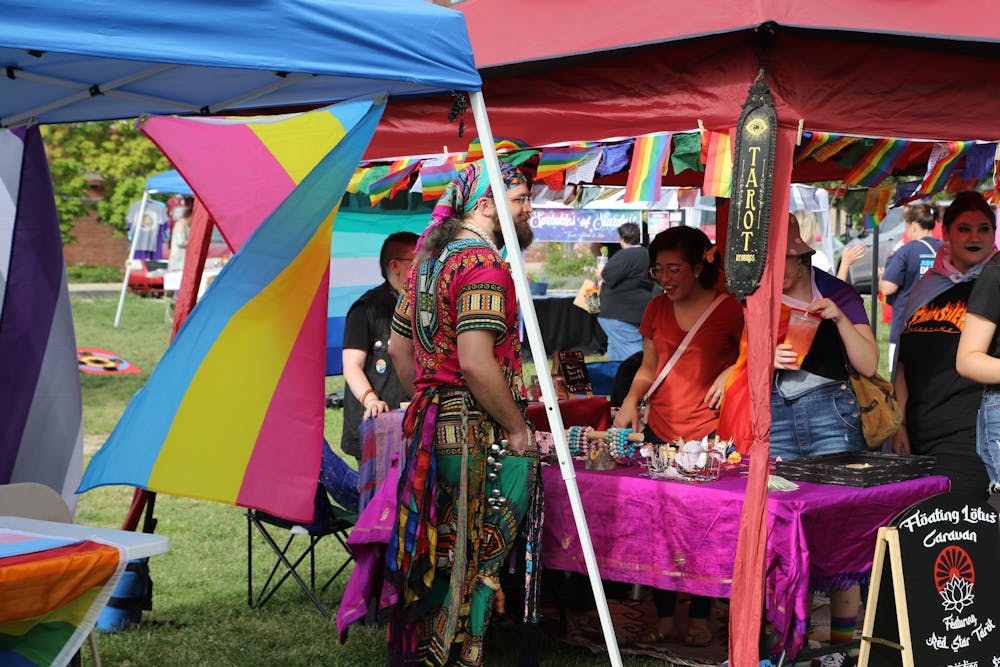<p>A vendor sets up shop at the Pride festival at Canan Commons in downtown Muncie, Sept. 3, 2022. (Mya Cataline, DN)</p>