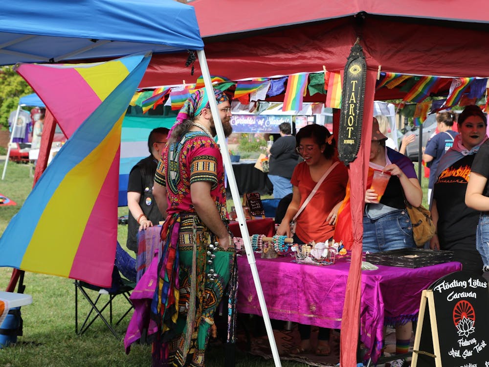 A vendor sets up shop at the Pride festival at Canan Commons in downtown Muncie, Sept. 3, 2022. (Mya Cataline, DN)