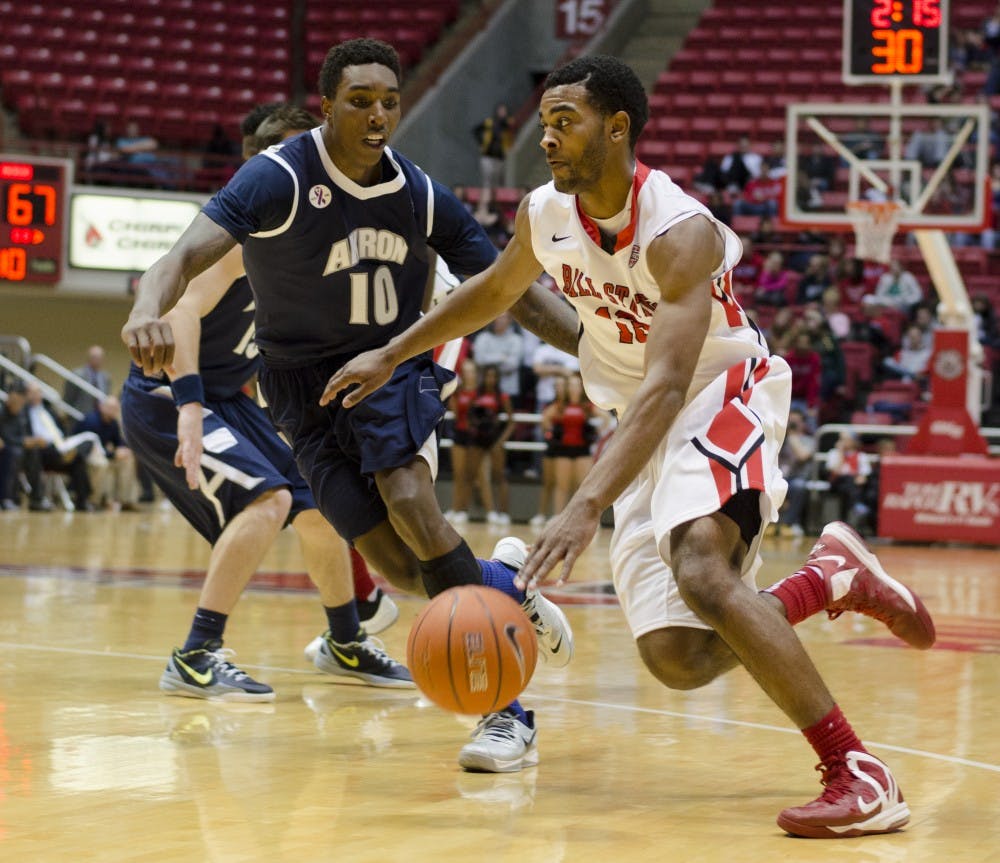 Freshman guard Mark Alstork drives the ball past an Akron player Jan. 8 at Worthen Arena. Alstork scored 10 points in the game. DN PHOTO BREANNA DAUGHERTY