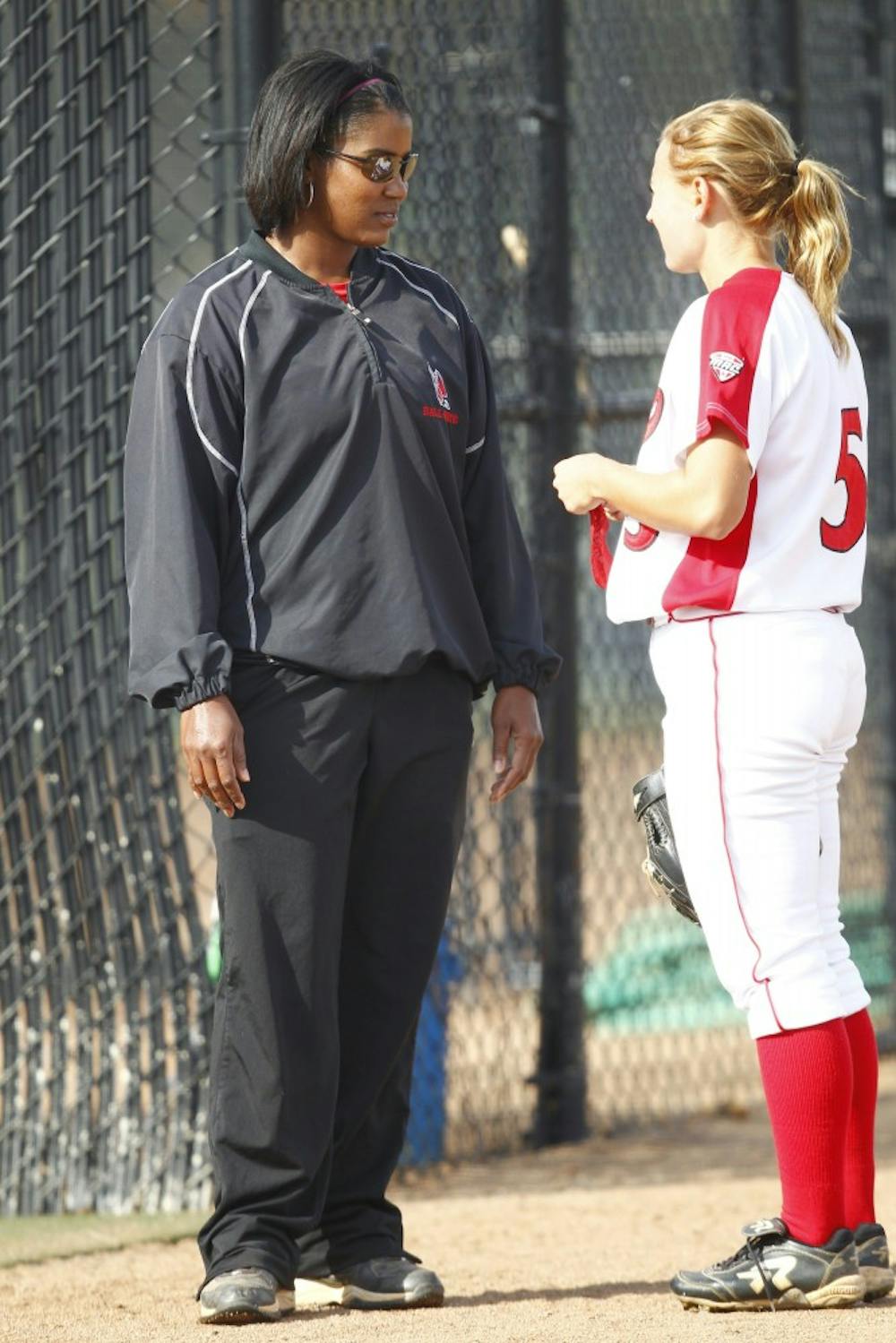 Head coach Tyra Perry speaks with outfielder Loren Cihlar during a practice. Perry inherited a team that finished 18-3 in the MAC last season. PHOTO PROVIDED ATHLETICS MEDIA RELATIONS