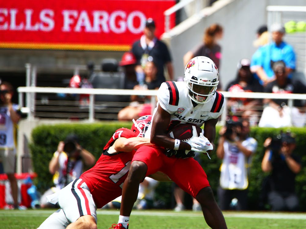 Redshirt sophomore wide receiver Qian Magwood gets tackled against Georgia Sept. 9 at Sanford Stadium in Athens, Ga. Magwood received a total of 12 yards in the game. Mya Cataline, DN