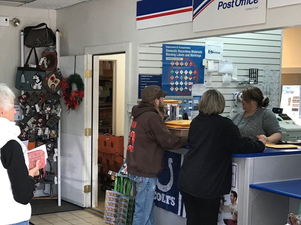 Mail room manager Shareen Wagley and staff work to fulfill shipping and shopping orders in the post office Nov. 25, 2017. Konnor Miller, Photo 