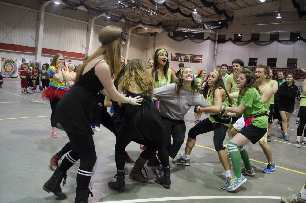 Members of the black team and the green team fight over a team member win a game at Ball State's Dance Marathon. DN PHOTO BREANNA DAUGHERTY 