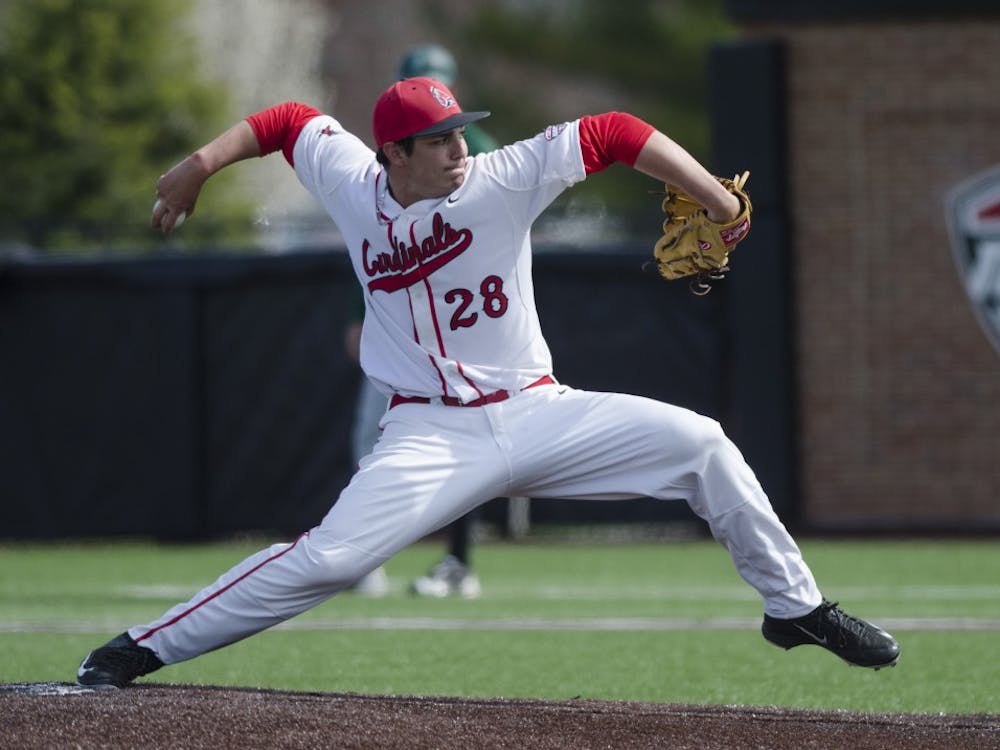 Sophomore pitcher TJ Harmon pitches the ball during the game against Ohio University on April 2 at the First Merchants Ballpark Complex. Ball State lost 10-0, bringing the Cardinals losing streak to eight games in a row. Emma Rogers // DN