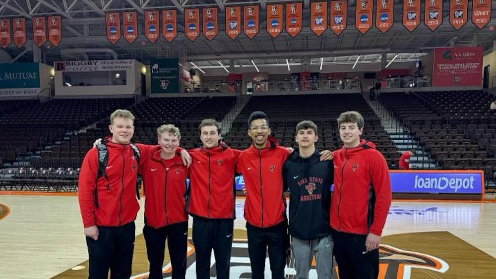 The Ball State men's basketball managers stand mid-court March 8 at the Stroh Center at Bowling Green University. Ball State Athletics, provided.