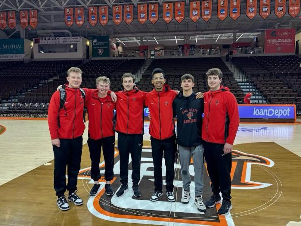 The Ball State men's basketball managers stand mid-court March 8 at the Stroh Center at Bowling Green University. Ball State Athletics, provided.