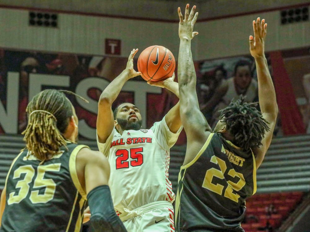 Redshirt senior, Tahjai Teague rises above two defenders to attempt a shot against Western Michigan Feb. 25, 2020, at John E. Worthen Arena. Teague added 13 points in 27 minutes in the win. Omari Smith, DN