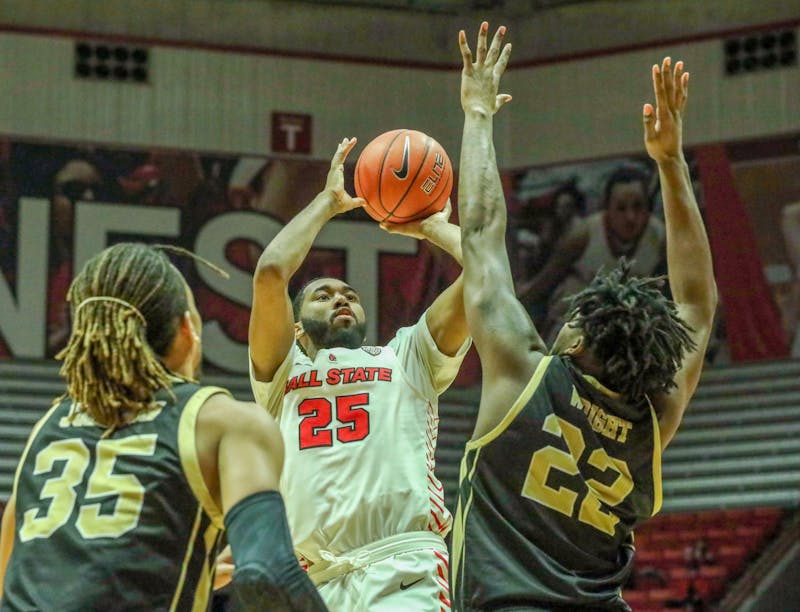 Redshirt senior, Tahjai Teague rises above two defenders to attempt a shot against Western Michigan Feb. 25, 2020, at John E. Worthen Arena. Teague added 13 points in 27 minutes in the win. Omari Smith, DN