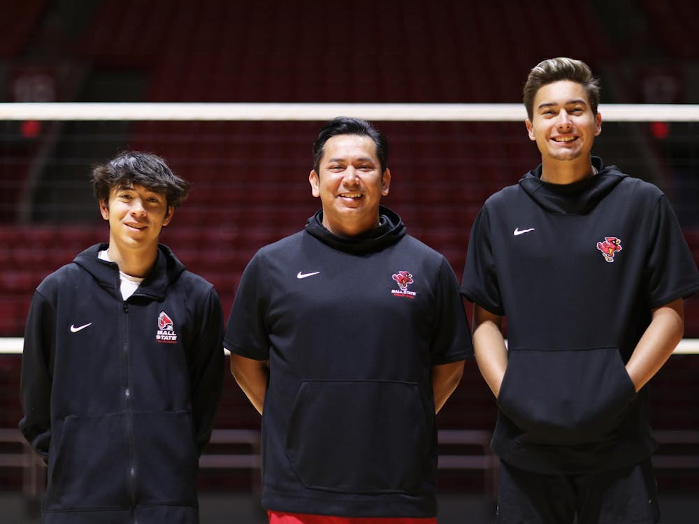 Junior libero Xander Pink (left), Head Coach Donan Cruz (middle) and Sophomore opposite hitter Keau Thompson (right) pose for a photo March 26 at Worthen Arena. The head coach and pair of players have helped lead Ball State men’s volleyball to a recent resurgence. Mya Cataline, DN