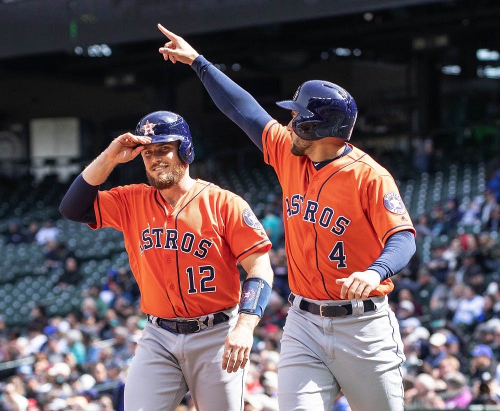 <p>The Houston Astros' George Springer (4) salutes Jose Altuve after he scored on Altuve's bases-loaded double in the fifth inning against the Seattle Mariners Thursday, April 19, 2018, at Safeco Field in Seattle. The Astros won, 9-2. <strong>(Dean Rutz/Seattle Times/TNS)</strong></p>