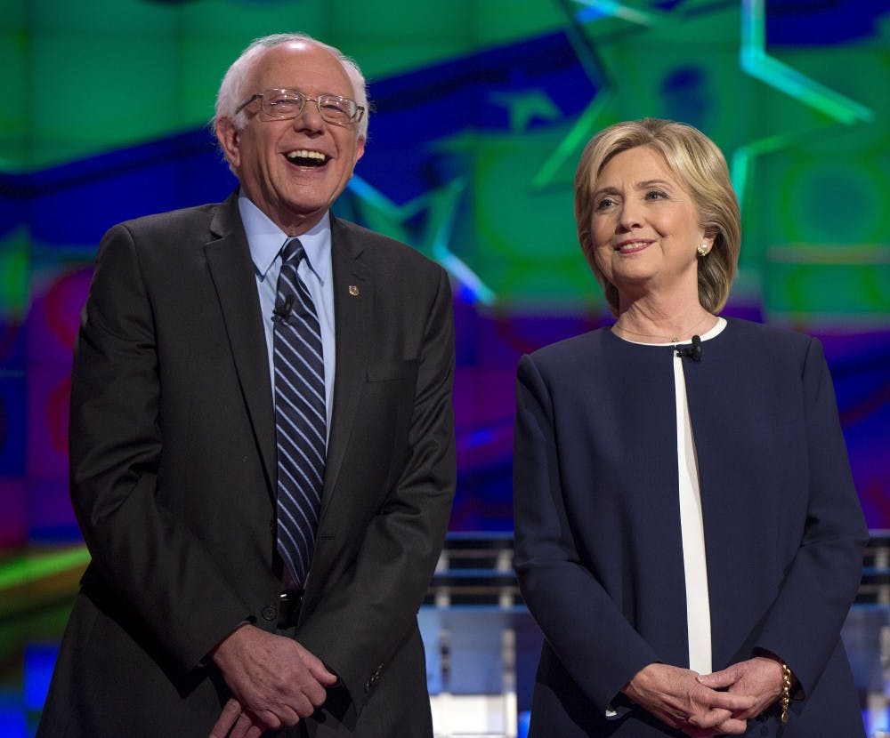 Bernie Sanders and Hillary Clinton on the debate stage on Tuesday, Oct. 13, 2015, in Las Vegas. (Brian Cahn/Zuma Press/TNS)