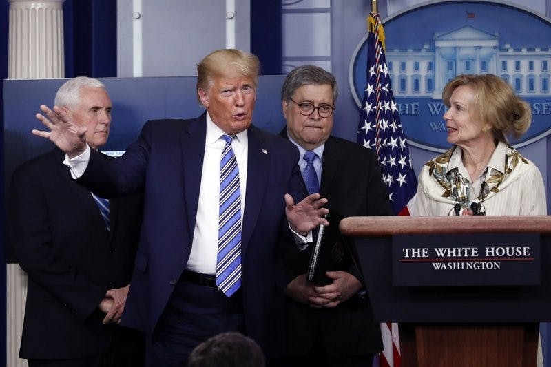 President Donald Trump gestures as he asks a question to Dr. Deborah Birx, White House coronavirus response coordinator, during a briefing about the coronavirus in the James Brady Briefing Room March 23, 2020, in Washington. (AP Photo/Alex Brandon)
