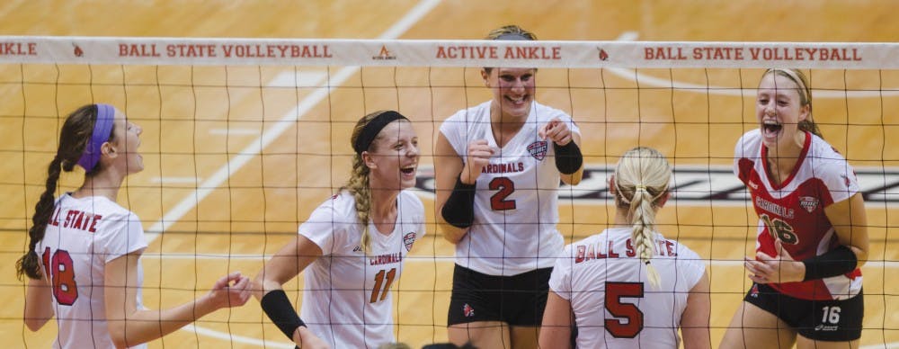 The team celebrates after getting another point in the second set against Buffalo on Oct. 5 at Worthen Arena. Ball State will face Kent State on the road Oct. 18. DN FILE PHOTO BREANNA DAUGHERTY