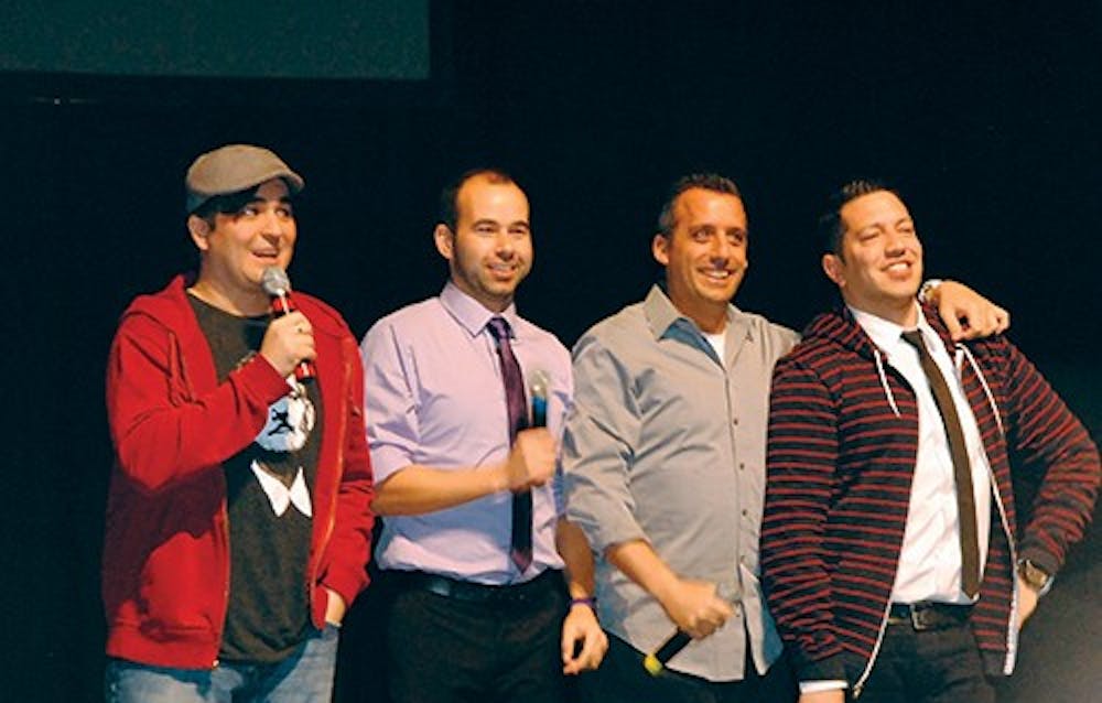 The cast of Impractical Jokers poses for crowd photos after their show on Feb. 16. The comedy group
