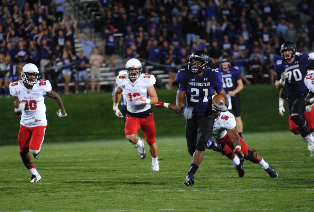 Senior defensive end Michael Ayers attempts to tackle Northwestern
