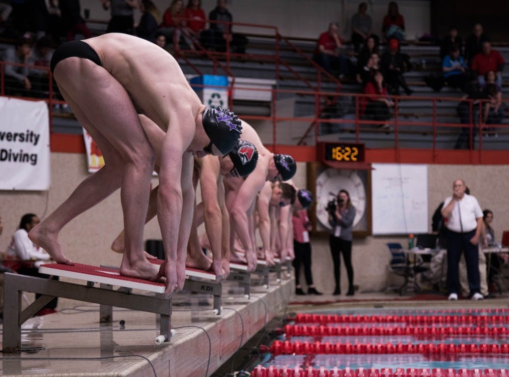 Swimmers prepare to enter the water at the Ball State v. Evansville meet at the Lewellen Pool Jan. 18, 2019. Jack Hart, DN
